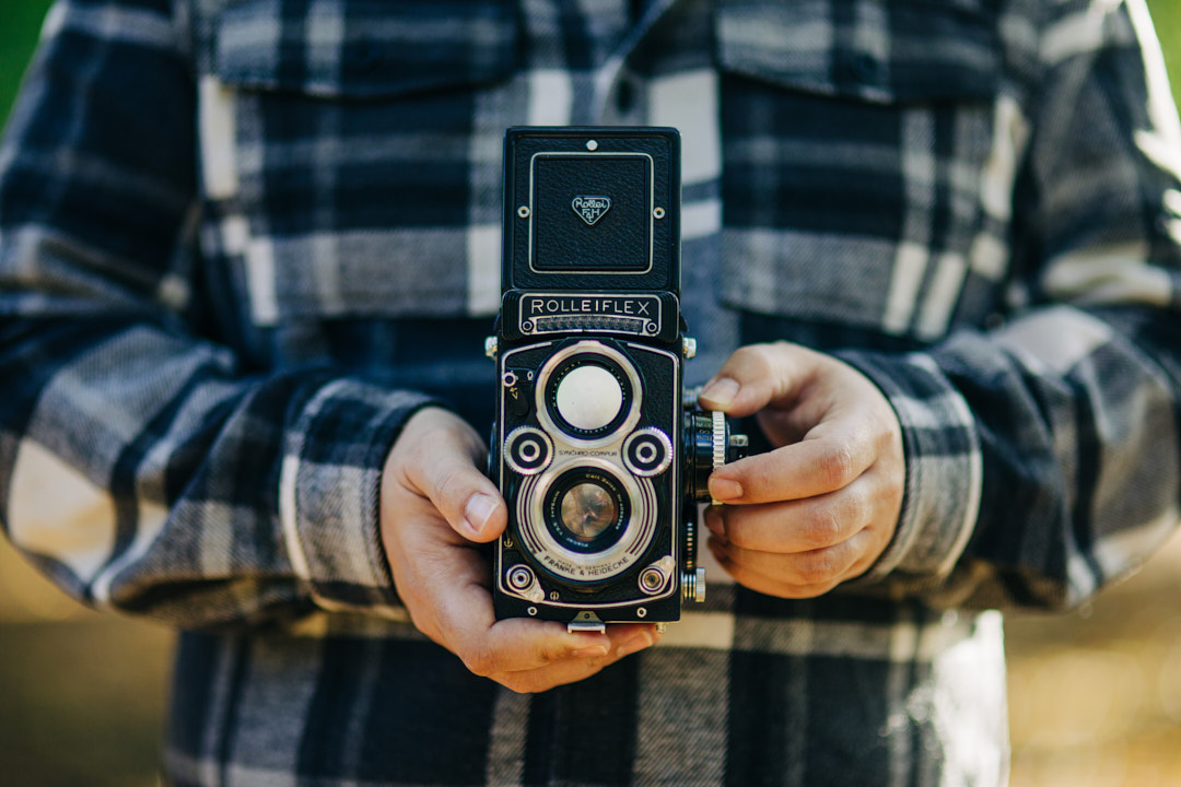 Photographer holding a rolleiflex